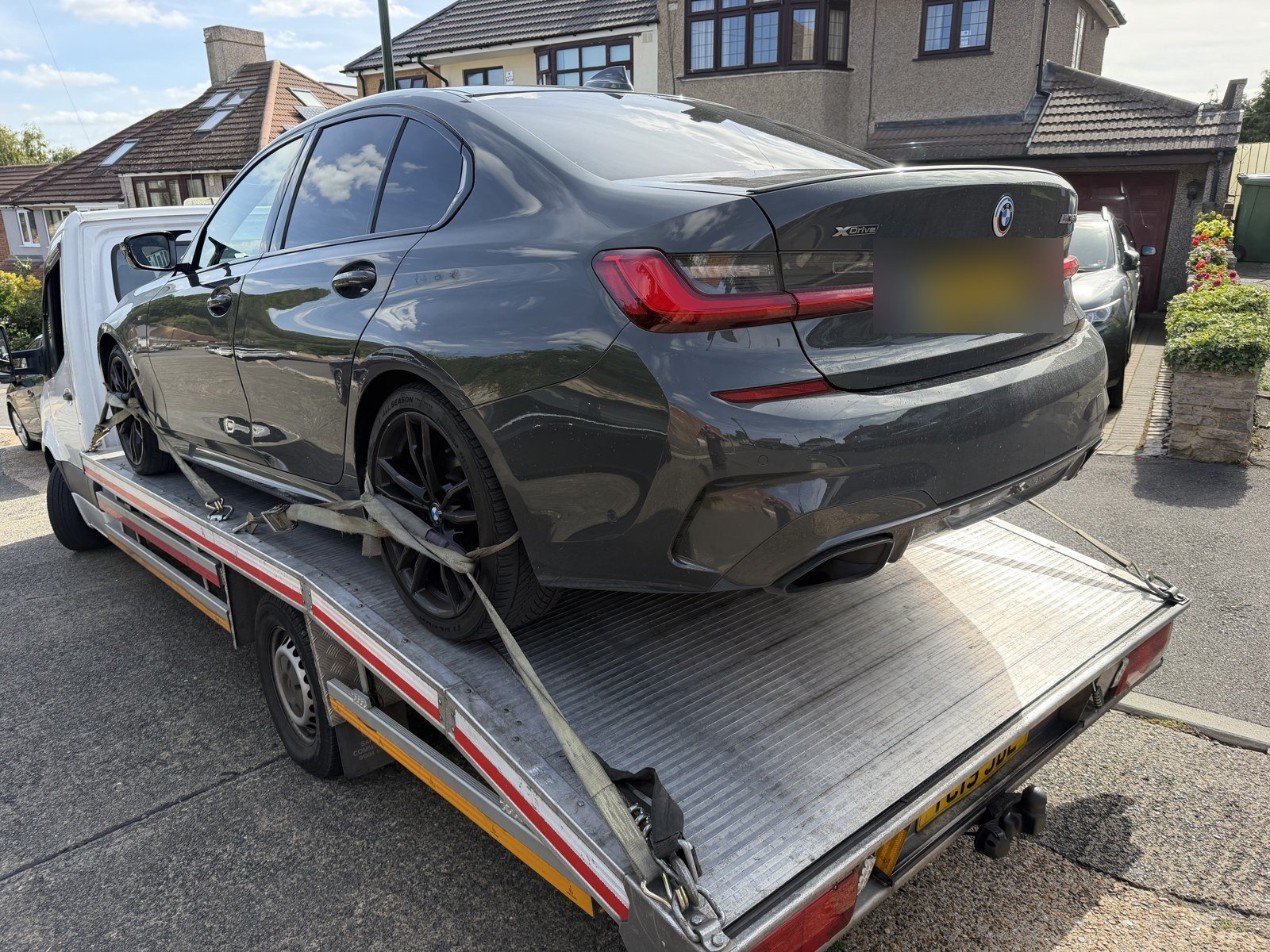 BMW 3 Series loaded on a Recovery Car flatbed after an accident, South East London