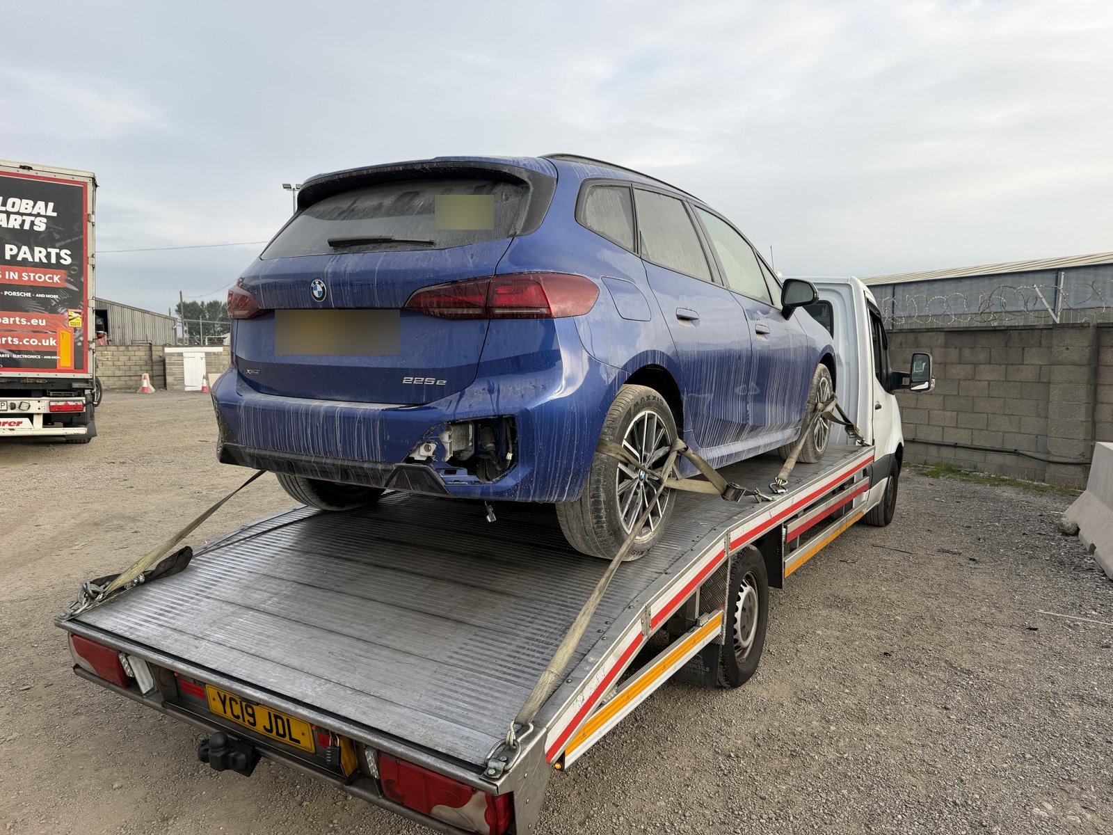 Auction car collection: BMW loaded on a Recovery Car flatbed at an auction yard, South East London