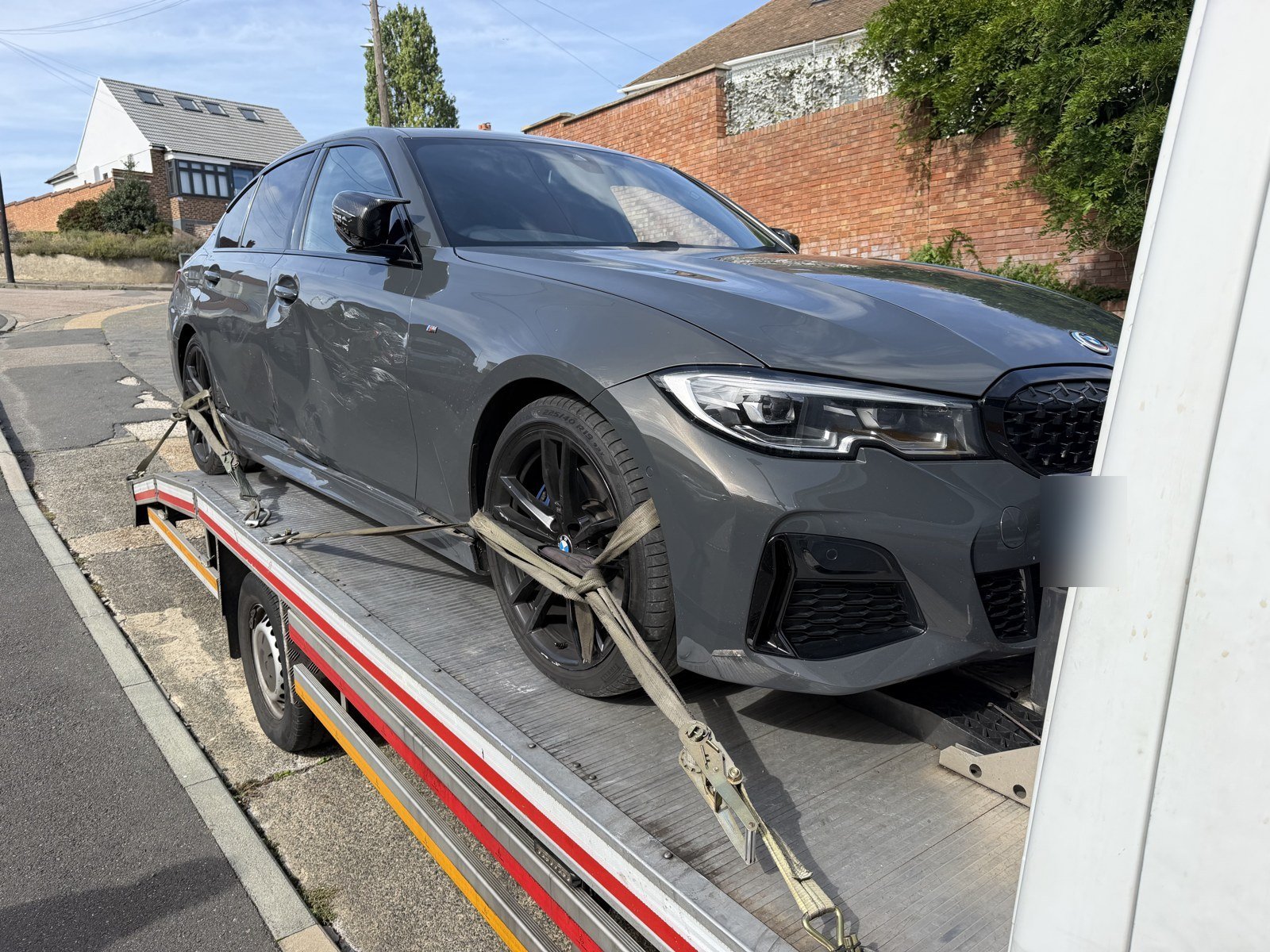 Classic Car Broken Down? Why It Needs a Gentler Approach 1 BMW strapped down on a Recovery Car flatbed for safe transport, South East London