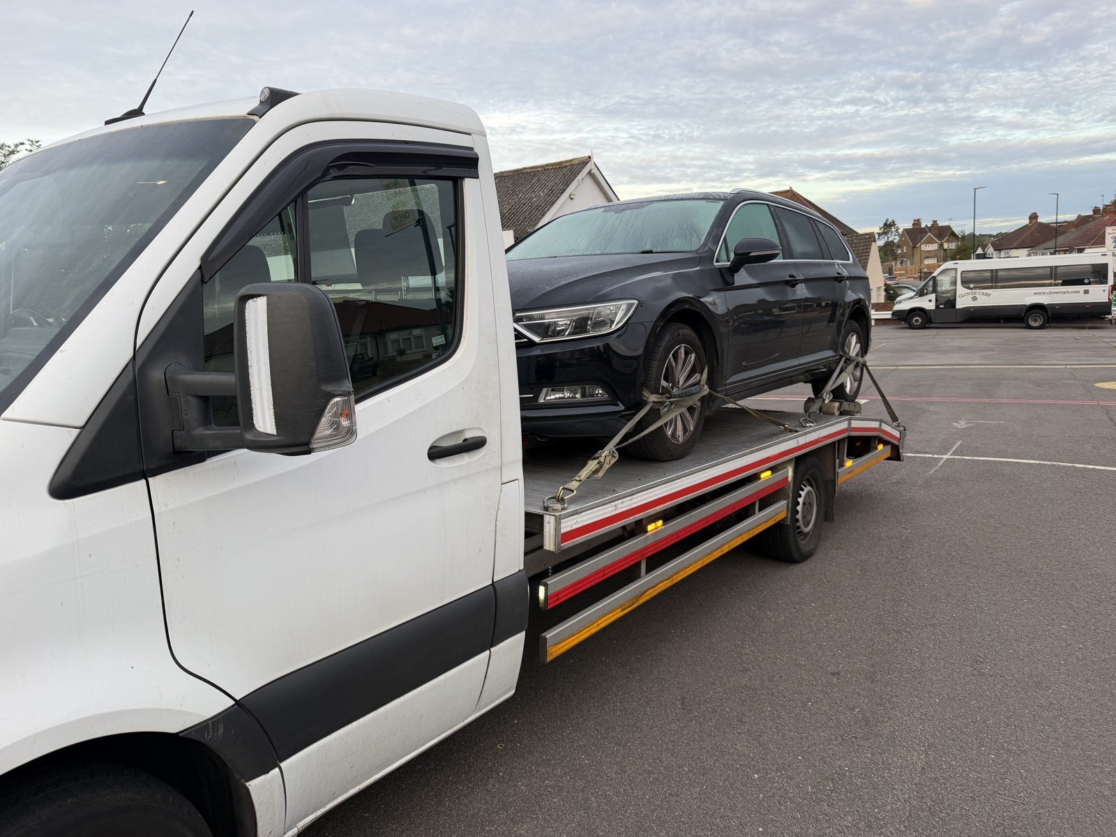 Locked Out or Keyless Fob Not Working? Here Are Your Options 1 Recovery Car flatbed truck transporting a VW Passat to a dealer, London