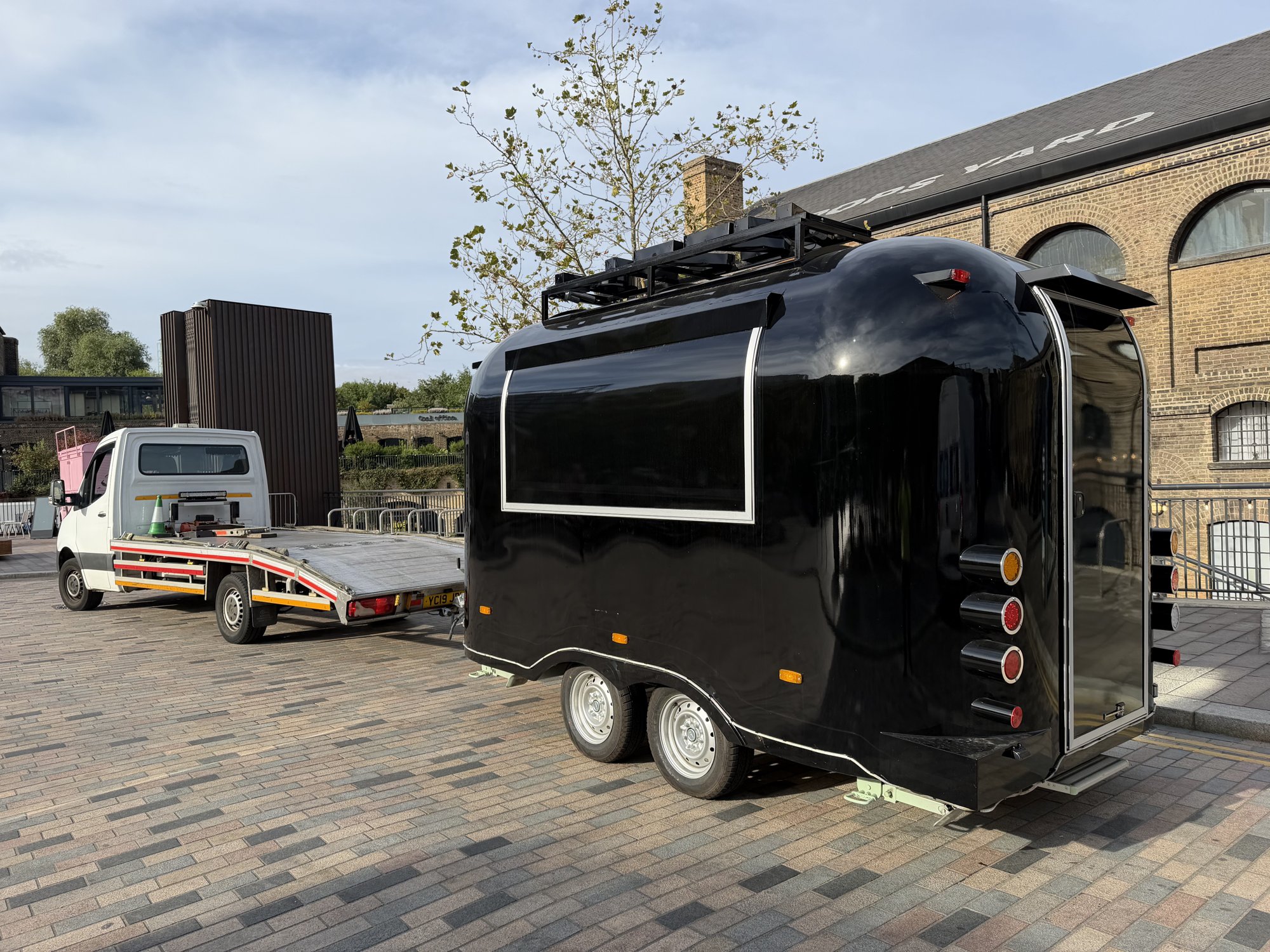 Black catering food trailer recovered by RecoveryCar in King's Cross, London